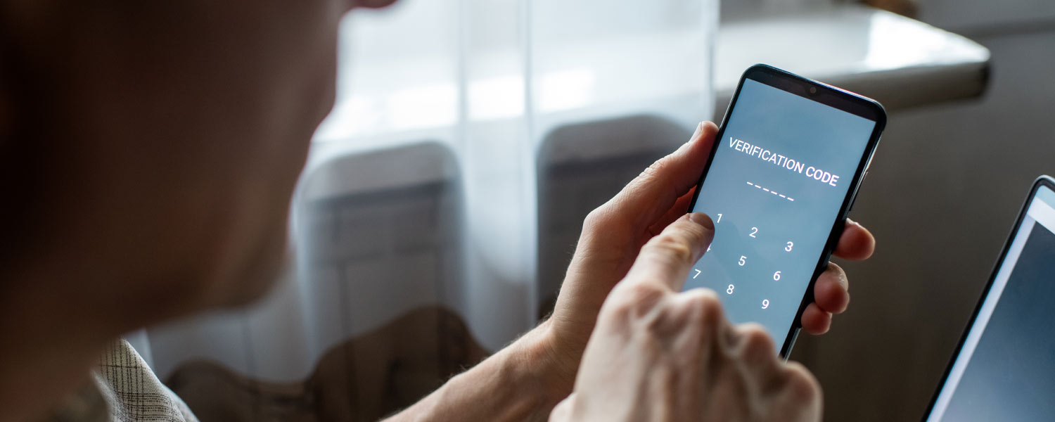 Person typing their phone passcode