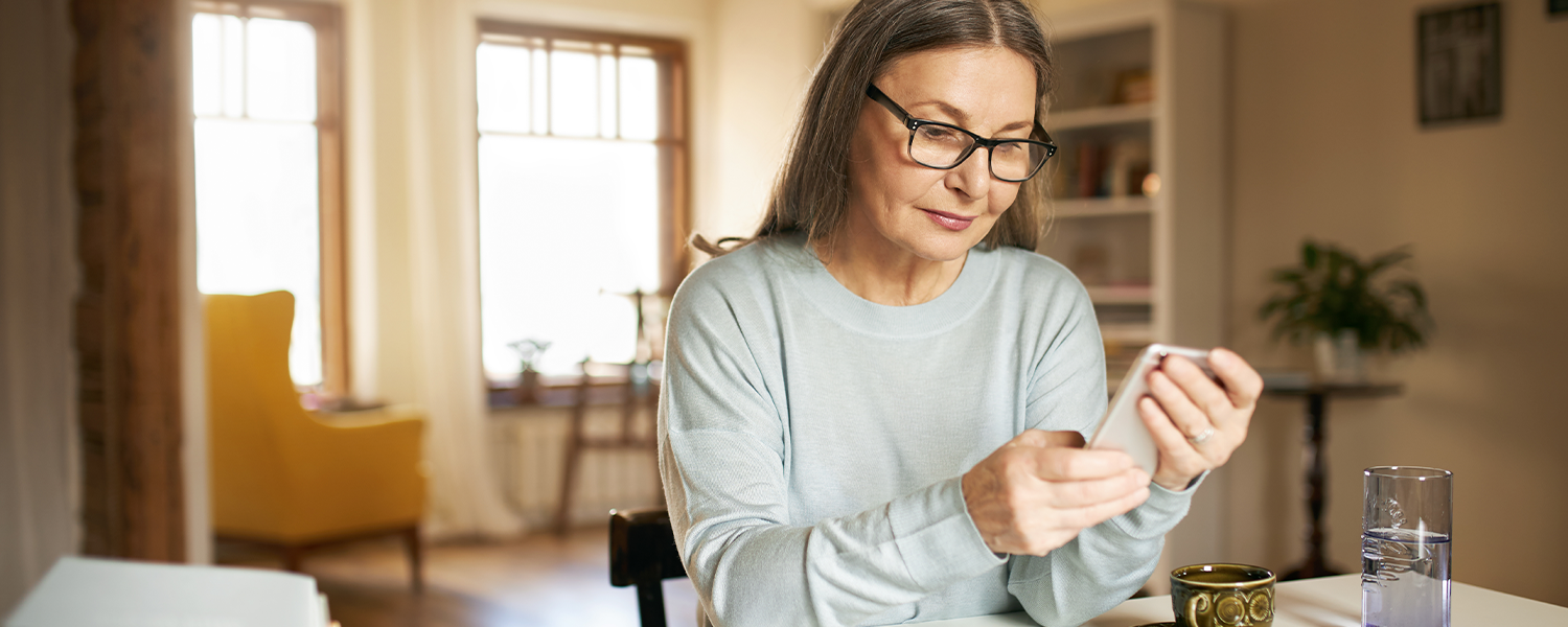Older woman looking at phone
