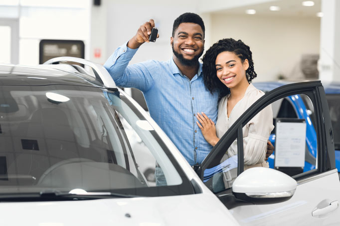 couple buying a car