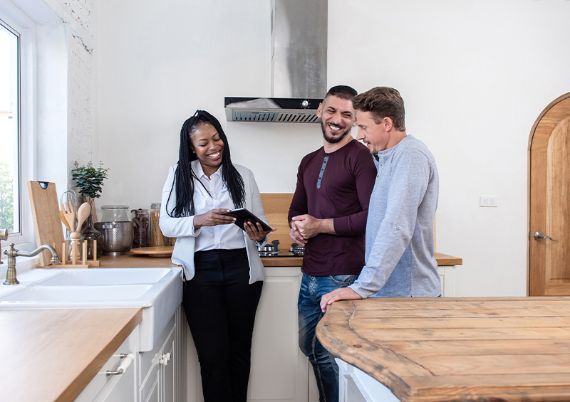 realtor showing home to couple